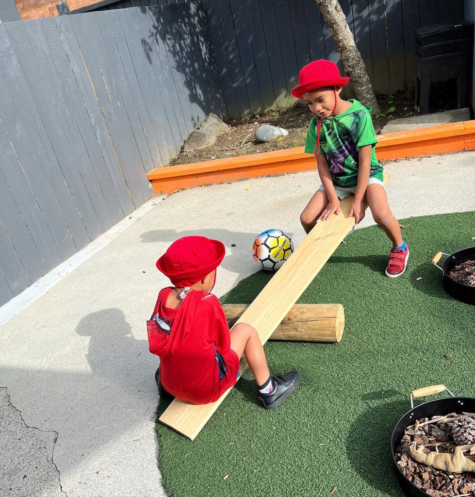 Children playing on seesaw